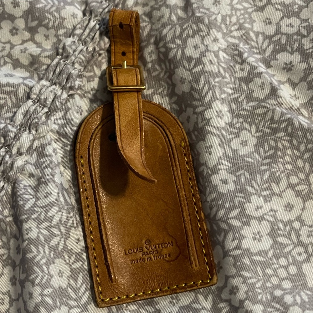 Louis Vuitton luggage tag.